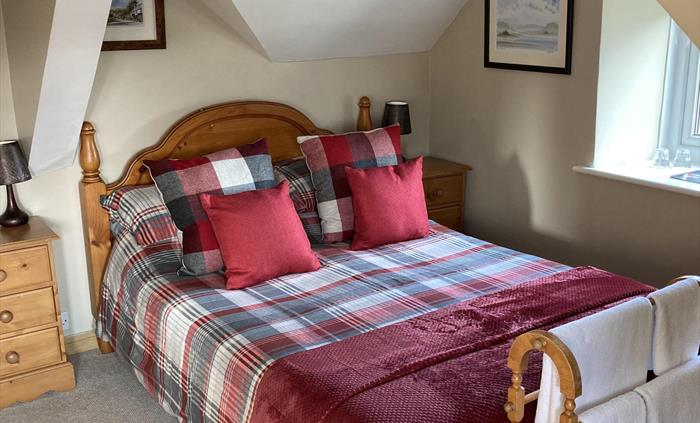 A double room for 2, ensuite shower.  Over looking the lake at the front and to the side the land that Llwyn Onn sits on.